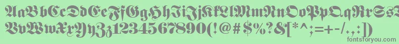 Fetteclassicunzfraktur-Schriftart – Graue Schriften auf grünem Hintergrund
