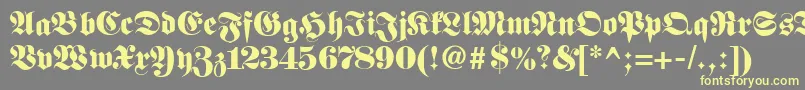 Fetteclassicunzfraktur-Schriftart – Gelbe Schriften auf grauem Hintergrund