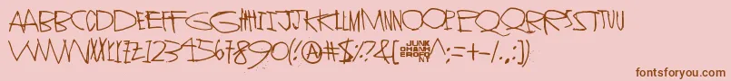 Шрифт StrangerInYou – коричневые шрифты на розовом фоне