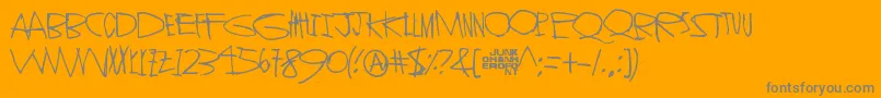 StrangerInYou-fontti – harmaat kirjasimet oranssilla taustalla