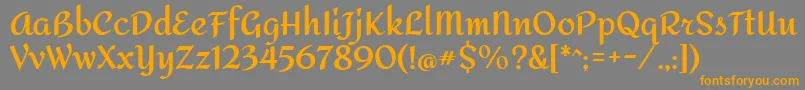 フォントAmitaBold – オレンジの文字は灰色の背景にあります。