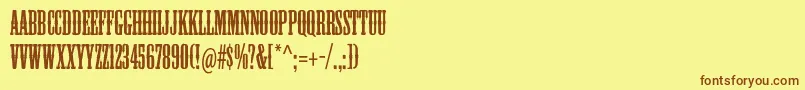 フォントMesquitestd – 茶色の文字が黄色の背景にあります。