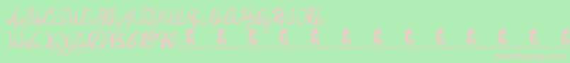 Motives-fontti – vaaleanpunaiset fontit vihreällä taustalla