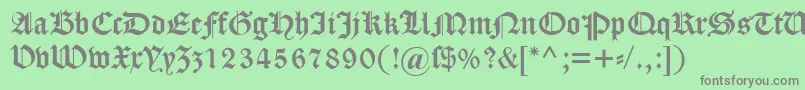 フォントDscaslongotisch – 緑の背景に灰色の文字