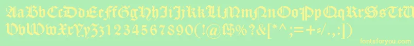 Dscaslongotisch-fontti – keltaiset fontit vihreällä taustalla