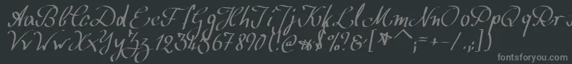 フォントWolgastScript – 黒い背景に灰色の文字