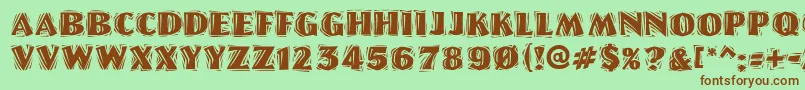 LinoletterCutRaggedRegular-fontti – ruskeat fontit vihreällä taustalla
