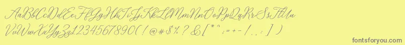 RosabeliaSldt-Schriftart – Graue Schriften auf gelbem Hintergrund