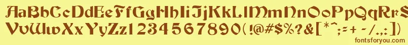 フォントTutbur – 茶色の文字が黄色の背景にあります。