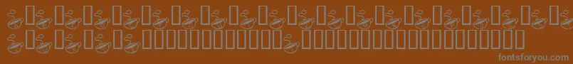 KrMorningMust-fontti – harmaat kirjasimet ruskealla taustalla