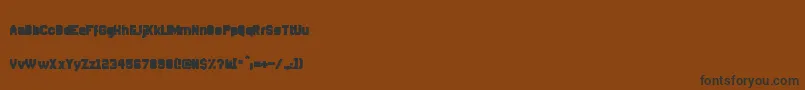 Czcionka DisparadorFilled – czarne czcionki na brązowym tle