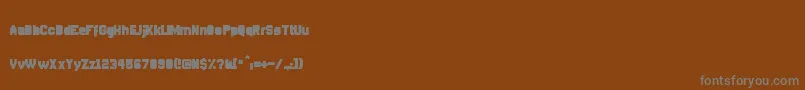 Czcionka DisparadorFilled – szare czcionki na brązowym tle