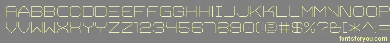 TrivialExtralight Font – Yellow Fonts on Gray Background