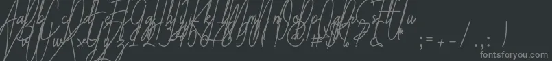 フォントGalliyani – 黒い背景に灰色の文字