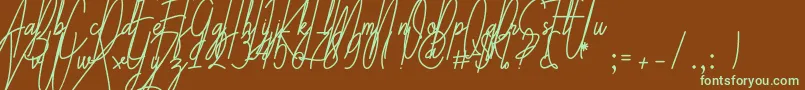 フォントGalliyani – 緑色の文字が茶色の背景にあります。