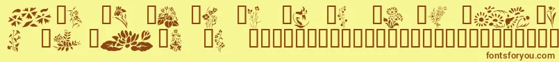 フォントWildflowers2 – 茶色の文字が黄色の背景にあります。