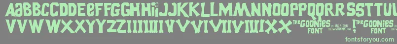 Czcionka GooniesThe – zielone czcionki na szarym tle