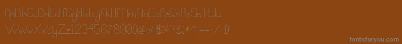 Шрифт Kindness – серые шрифты на коричневом фоне