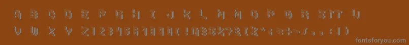 Czcionka DemoncubicblockfontShade – szare czcionki na brązowym tle