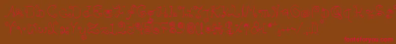 フォントBpilialena – 赤い文字が茶色の背景にあります。