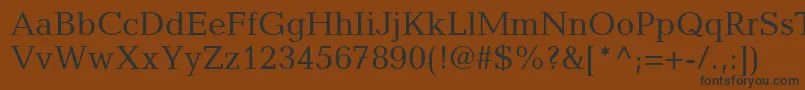 フォントMatiqueSsi – 黒い文字が茶色の背景にあります