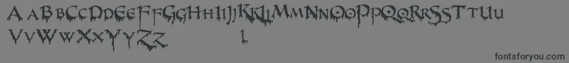 PrUncialCreepy-Schriftart – Schwarze Schriften auf grauem Hintergrund