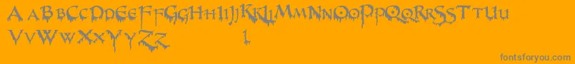 PrUncialCreepy-Schriftart – Graue Schriften auf orangefarbenem Hintergrund