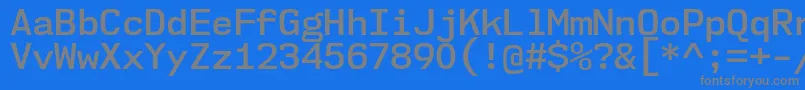 Nk57MonospaceNoSb-fontti – harmaat kirjasimet sinisellä taustalla