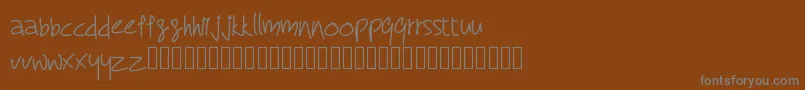 Więcej informacji o czcionce RcMyDreamFont Czcionka RcMyDreamFont – szare czcionki na brązowym tle