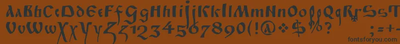 フォントFitaPoluustav – 黒い文字が茶色の背景にあります