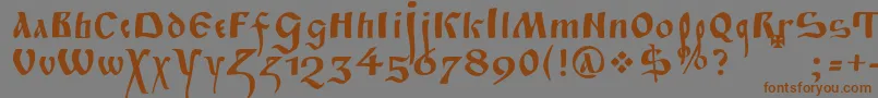フォントFitaPoluustav – 茶色の文字が灰色の背景にあります。