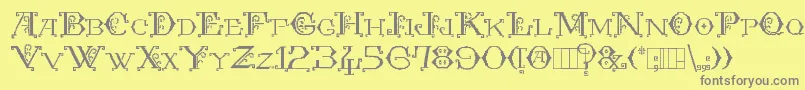 KingthingsEmbroidery-fontti – harmaat kirjasimet keltaisella taustalla