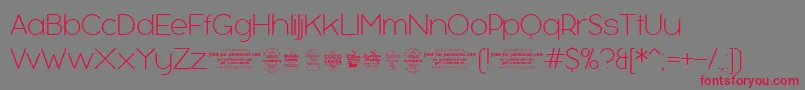 BubbleboddyExtralighttrial Font – Red Fonts on Gray Background