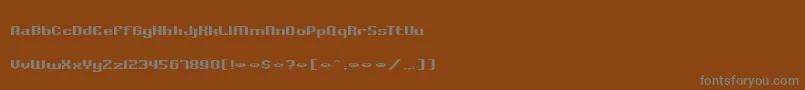 Czcionka BadlocicgCompression – szare czcionki na brązowym tle