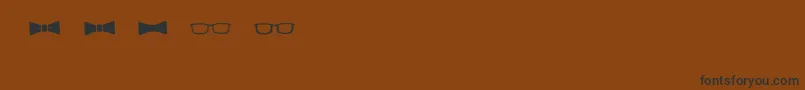 フォントBmdGeektasticAccessories – 黒い文字が茶色の背景にあります