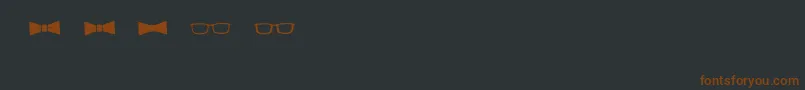 BmdGeektasticAccessories-fontti – ruskeat fontit mustalla taustalla