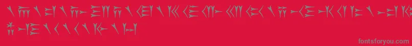 Fonte Oldpersiancuneiform – fontes cinzas em um fundo vermelho