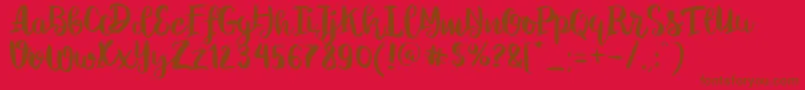 Fonte ChelseaBrushScript – fontes marrons em um fundo vermelho