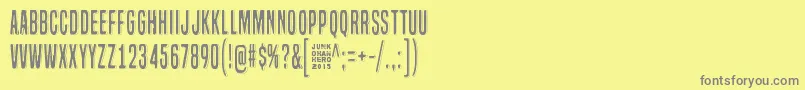 フォントLazyOpossum – 黄色の背景に灰色の文字