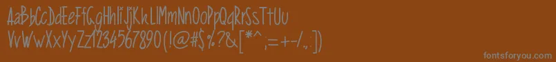 Pwverticalized-Schriftart – Graue Schriften auf braunem Hintergrund