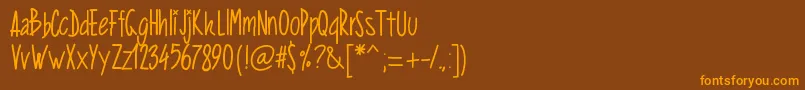 フォントPwverticalized – オレンジ色の文字が茶色の背景にあります。
