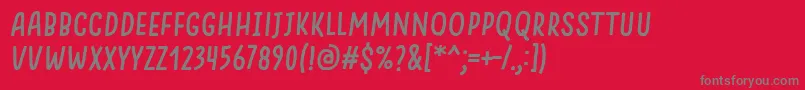 SomethingLooksNaturalItalic-fontti – harmaat kirjasimet punaisella taustalla