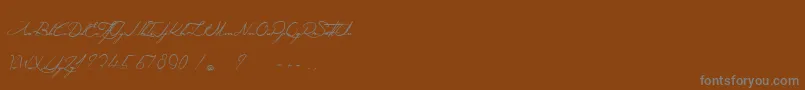 Czcionka AngeliqueMaDouceColombe – szare czcionki na brązowym tle