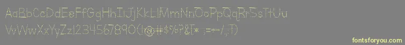 BmdLettersForLearnersLinedDotsHattedJ Font – Yellow Fonts on Gray Background