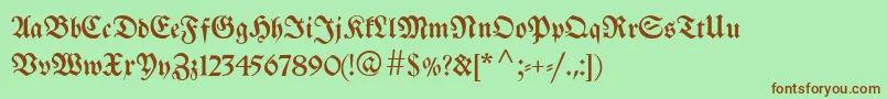 Breitkopffraktur-Schriftart – Braune Schriften auf grünem Hintergrund