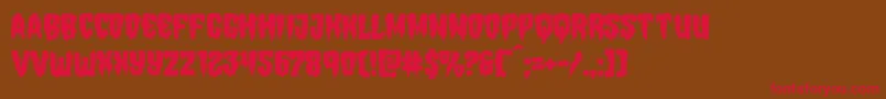 フォントHemogoblinmangle – 赤い文字が茶色の背景にあります。