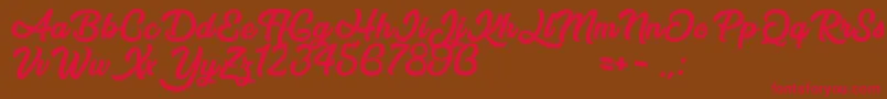 フォントAfterNight – 赤い文字が茶色の背景にあります。