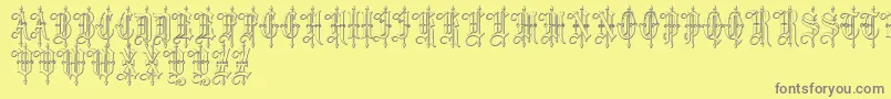 LeothricBeveled-Schriftart – Graue Schriften auf gelbem Hintergrund