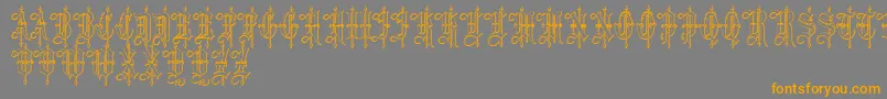 フォントLeothricBeveled – オレンジの文字は灰色の背景にあります。