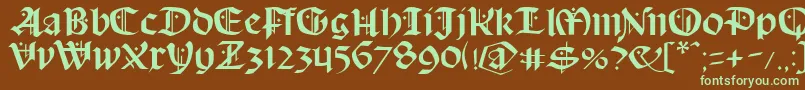 フォントSchampelBlack – 緑色の文字が茶色の背景にあります。